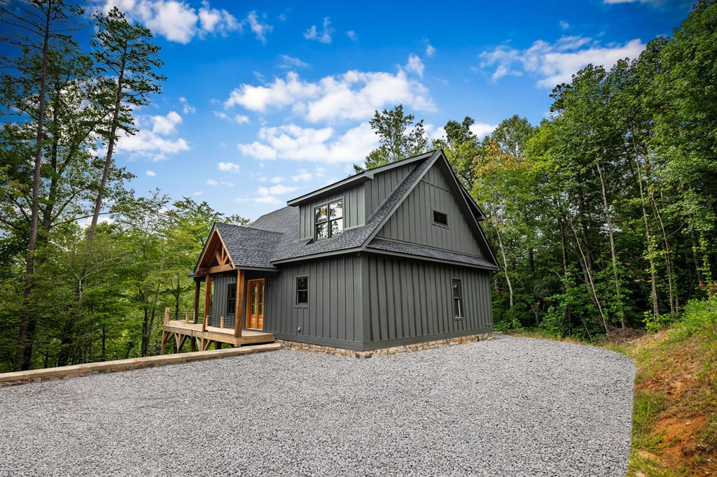 1204 Settler's Ridge Road Ellijay, GA 30540 - Photo 26 of 62 a backyard of a house with lots of green space