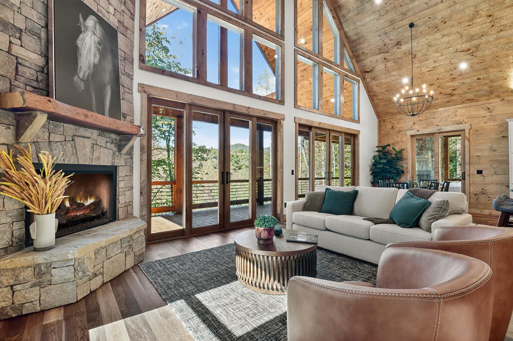 1204 Settler's Ridge Road Ellijay, GA 30540 - Photo 3 of 62 a living room with furniture fireplace and a large window