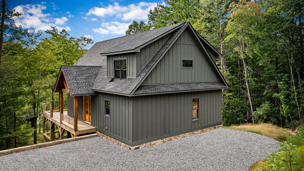 1204 Settler's Ridge Road Ellijay, GA 30540 - Photo 34 of 62 a front view of a house with a yard and garage