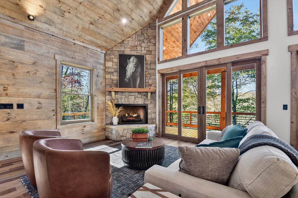 1204 Settler's Ridge Road Ellijay, GA 30540 - Photo 35 of 62 a living room with furniture and a large window