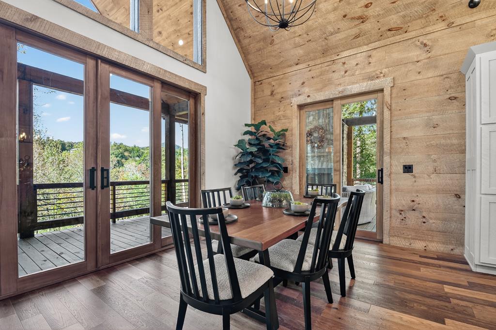 1204 Settler's Ridge Road Ellijay, GA 30540 - Photo 36 of 62 a view of a dining room with furniture window and wooden floor