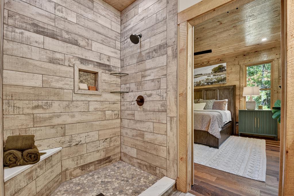 1204 Settler's Ridge Road Ellijay, GA 30540 - Photo 43 of 62 a bathroom with a tub and shower