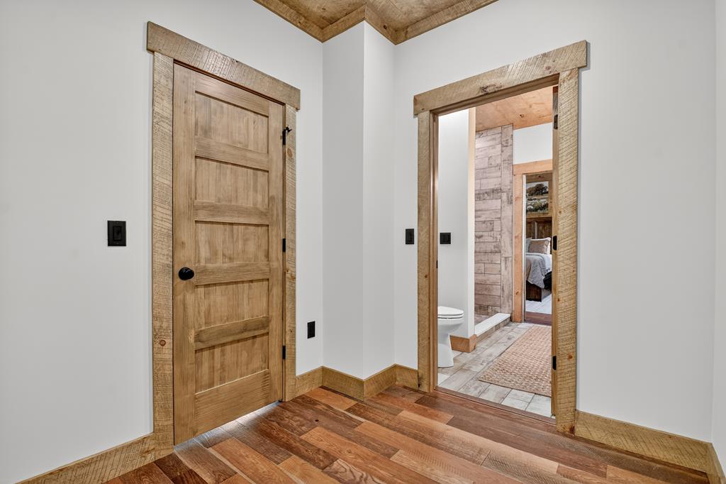 1204 Settler's Ridge Road Ellijay, GA 30540 - Photo 44 of 62 a view of a bathroom with a door and a window