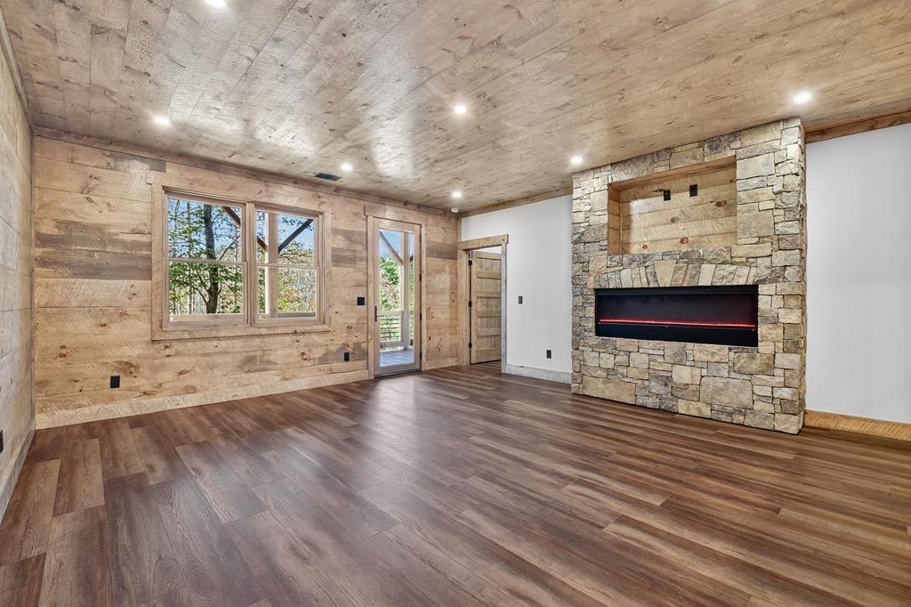 1204 Settler's Ridge Road Ellijay, GA 30540 - Photo 48 of 62 a view of an empty room with wooden floor and a window