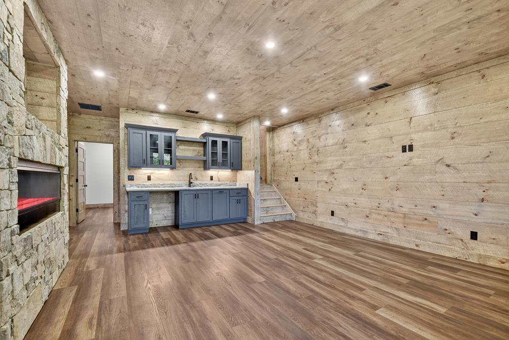 1204 Settler's Ridge Road Ellijay, GA 30540 - Photo 50 of 62 a view of kitchen with stainless steel appliances kitchen island wooden cabinets and granite counter tops