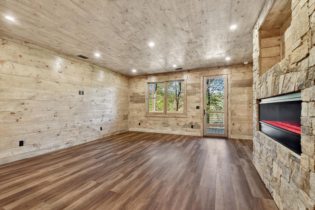 1204 Settler's Ridge Road Ellijay, GA 30540 - Photo 52 of 62 a view of an empty room with a window and wooden floor