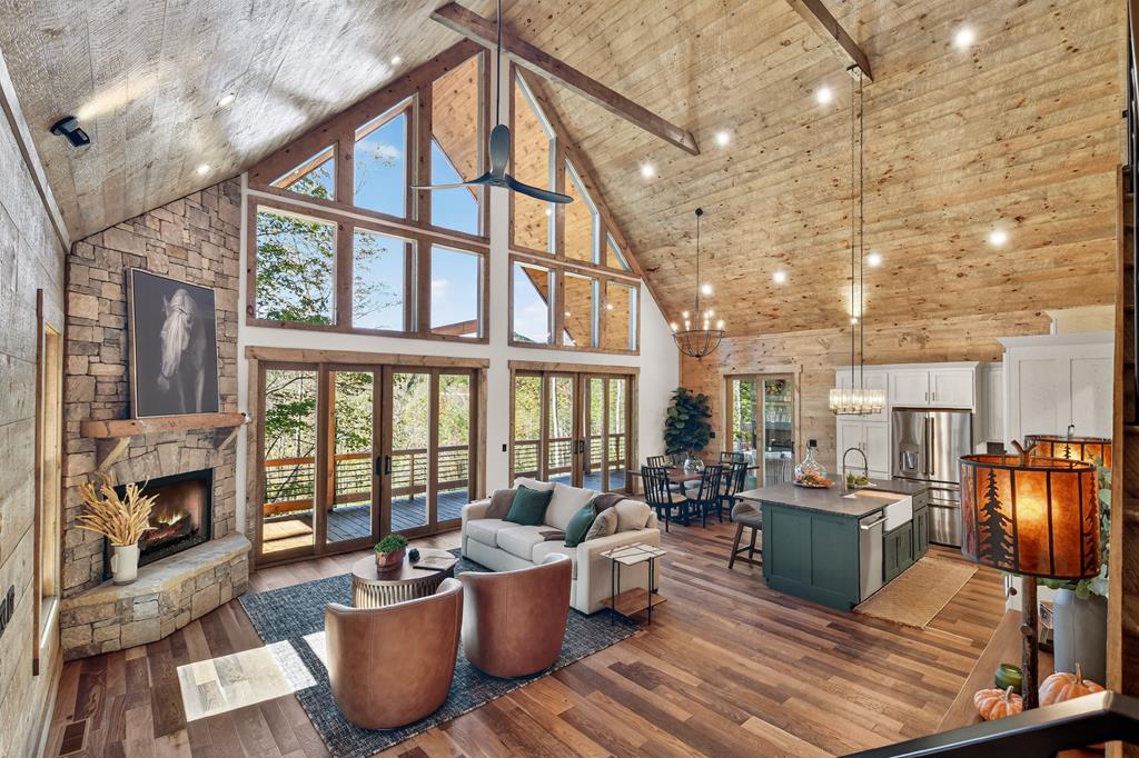 1204 Settler's Ridge Road Ellijay, GA 30540 - Photo 58 of 62 a living room with furniture fireplace and flat screen tv