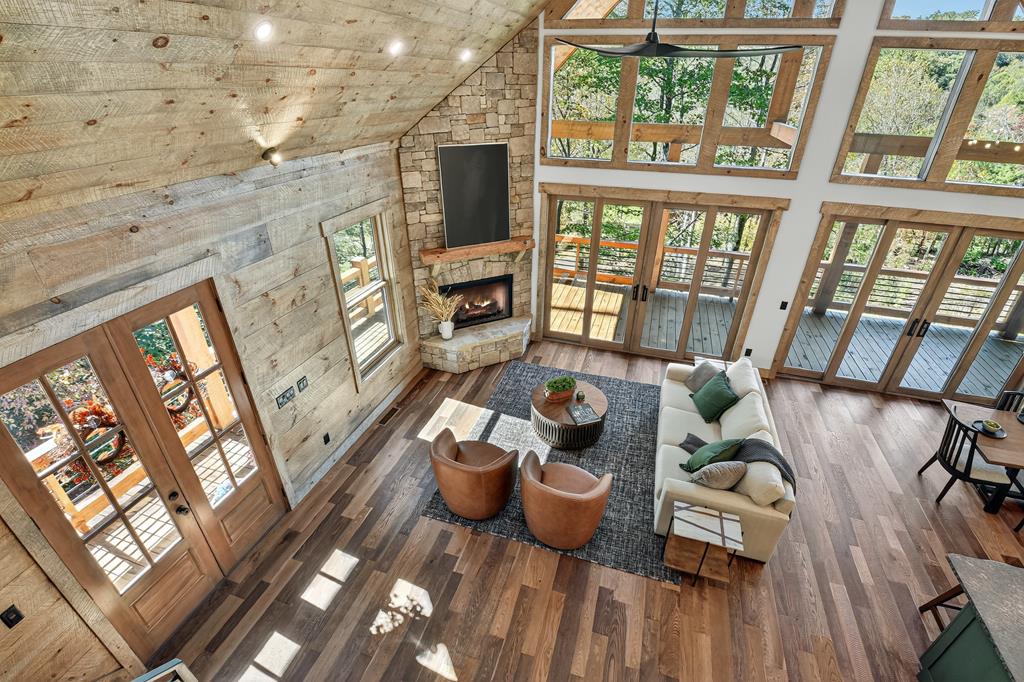 1204 Settler's Ridge Road Ellijay, GA 30540 - Photo 59 of 62 a living room with furniture and a floor to ceiling window