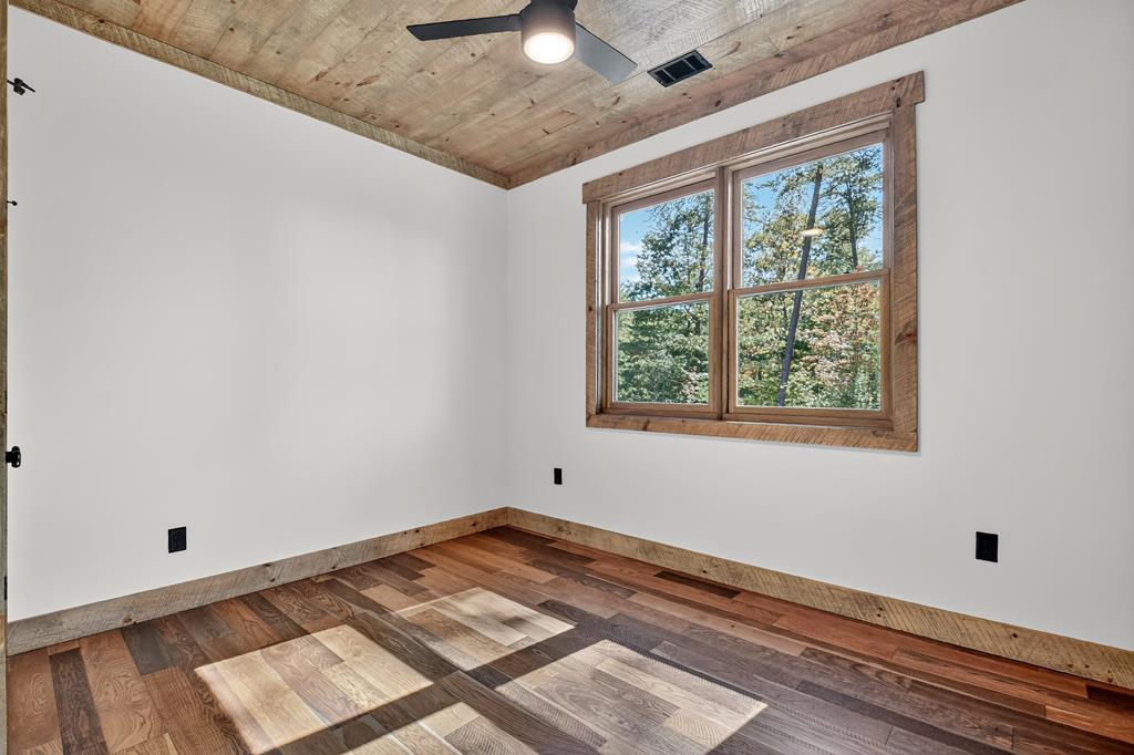 1204 Settler's Ridge Road Ellijay, GA 30540 - Photo 62 of 62 a view of a room with wooden floor and natural light