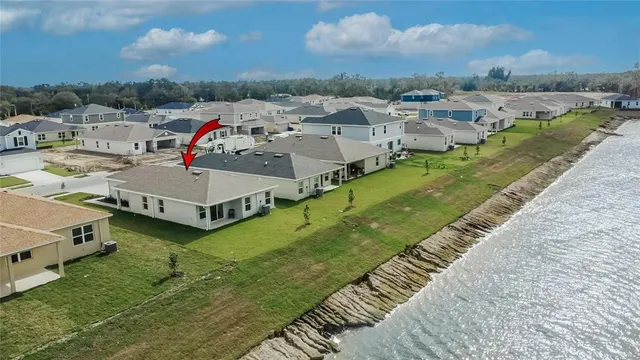 an aerial view of a house with outdoor space