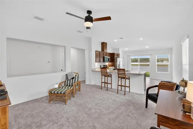 a view of a kitchen with sink cabinets and appliances