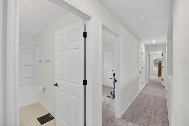 a bedroom with a bed and a ceiling fan