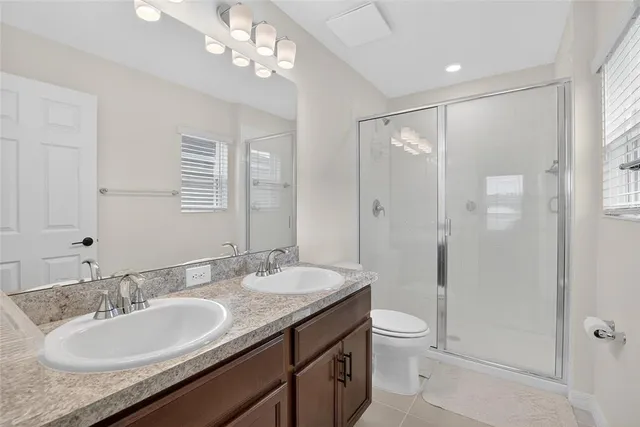 a bathroom with a shower and a toilet