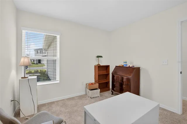 a bedroom with furniture and a window