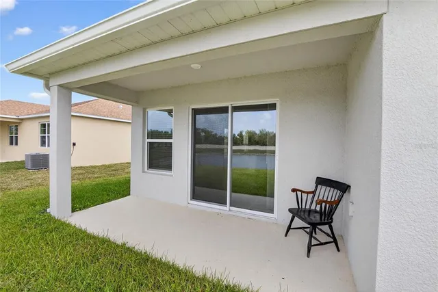 a view of a house with a yard and ocean view