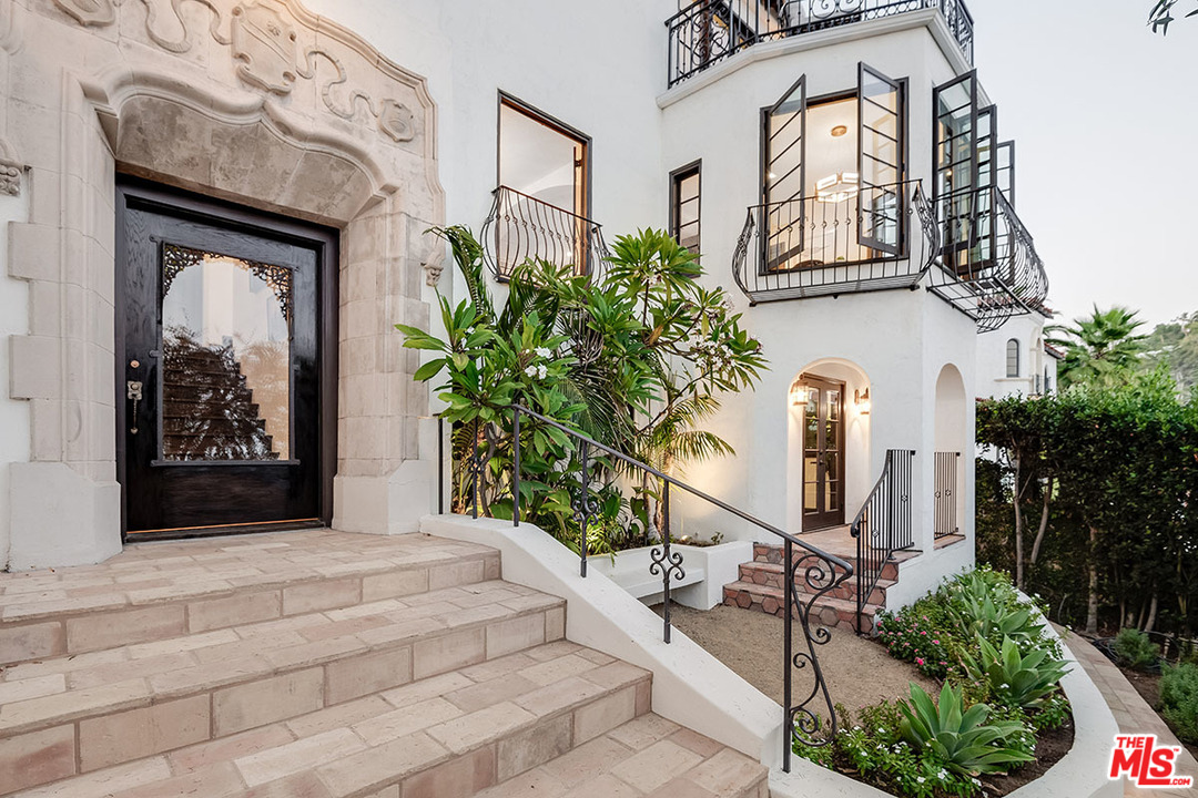2426 Chislehurst Drive Los Angeles, CA 90027 - Photo 2 of 43 a front view of a house with a yard and garage