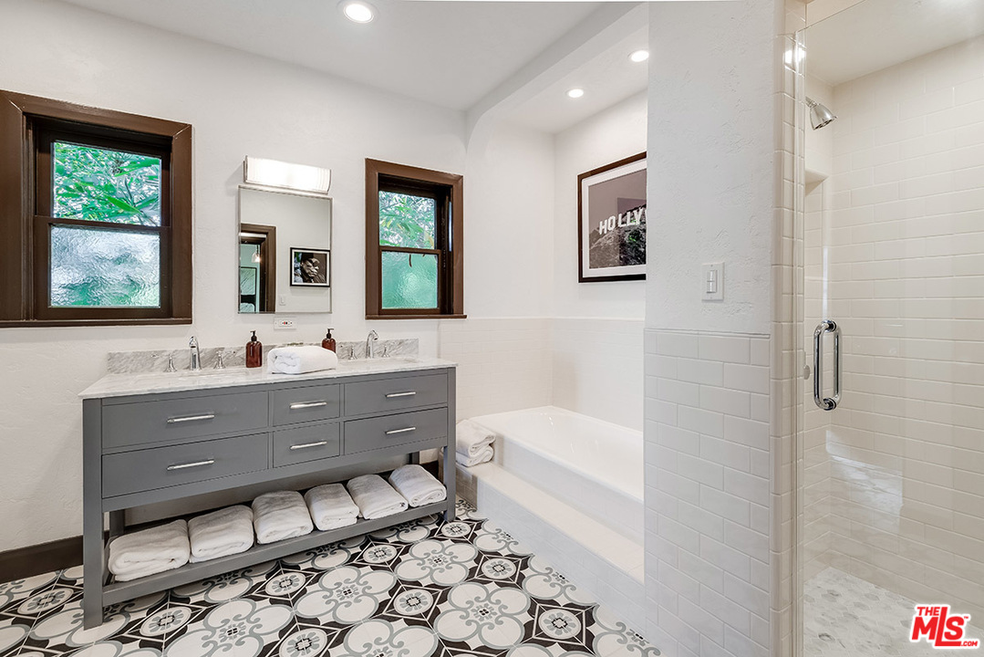 2426 Chislehurst Drive Los Angeles, CA 90027 - Photo 17 of 43 a bathroom with a sink mirror and a bathtub