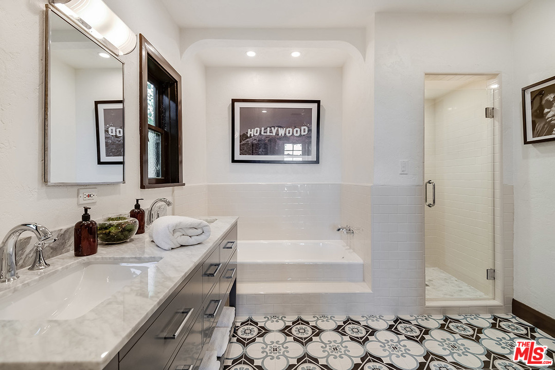 2426 Chislehurst Drive Los Angeles, CA 90027 - Photo 18 of 43 a bathroom with a tub sink and mirror