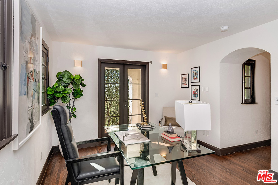 2426 Chislehurst Drive Los Angeles, CA 90027 - Photo 21 of 43 a view of a workspace with furniture and a potted plant