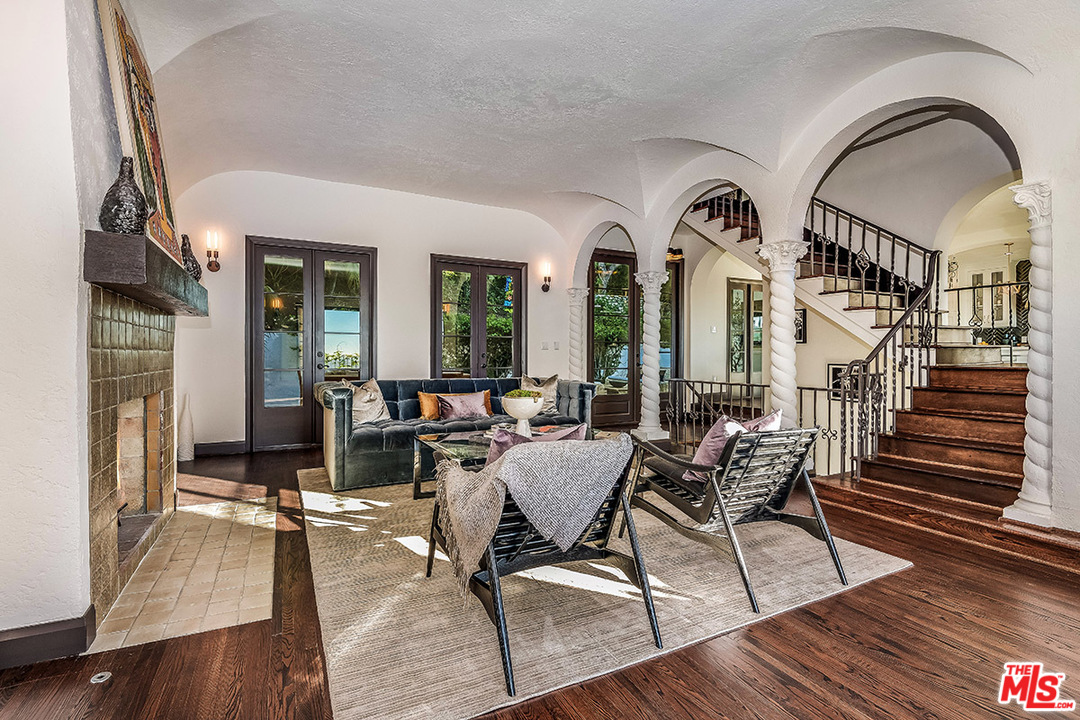 2426 Chislehurst Drive Los Angeles, CA 90027 - Photo 4 of 43 a living room with couches a dining table and chairs with wooden floor