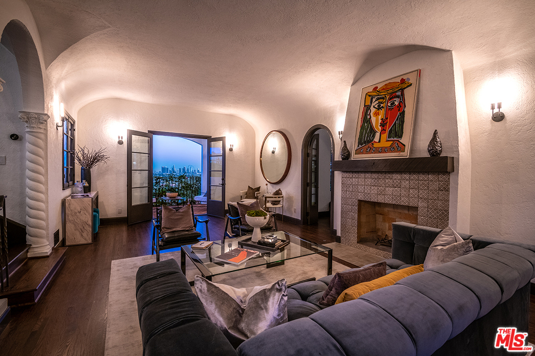 2426 Chislehurst Drive Los Angeles, CA 90027 - Photo 31 of 43 a living room with furniture and a fireplace