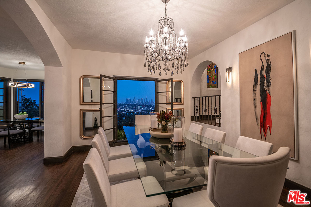 2426 Chislehurst Drive Los Angeles, CA 90027 - Photo 34 of 43 a living room with furniture and a chandelier