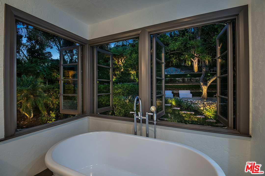 2426 Chislehurst Drive Los Angeles, CA 90027 - Photo 40 of 43 a living room filled with furniture and a large window