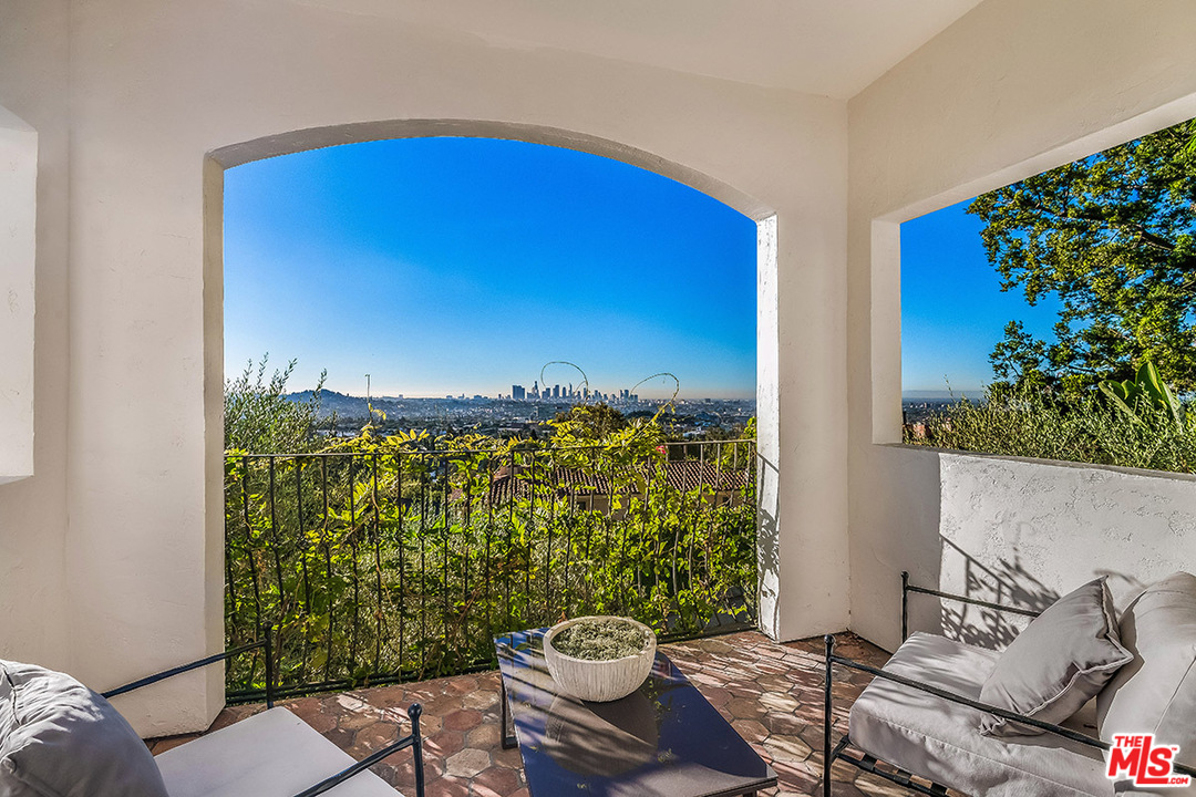2426 Chislehurst Drive Los Angeles, CA 90027 - Photo 5 of 43 a view of a balcony with chair and potted plants