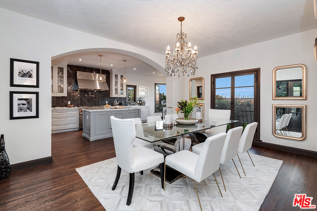 2426 Chislehurst Drive Los Angeles, CA 90027 - Photo 6 of 43 a view of a dining room with furniture wooden floor and chandelier