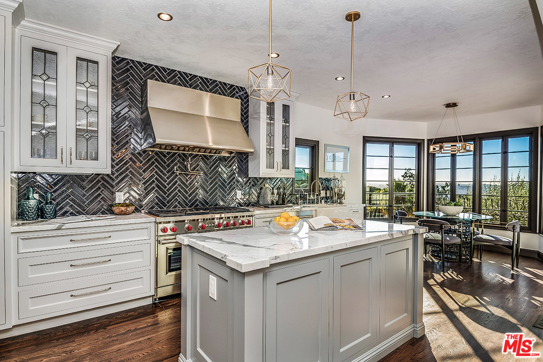 2426 Chislehurst Drive Los Angeles, CA 90027 - Photo 7 of 43 a kitchen with a sink stove and cabinets