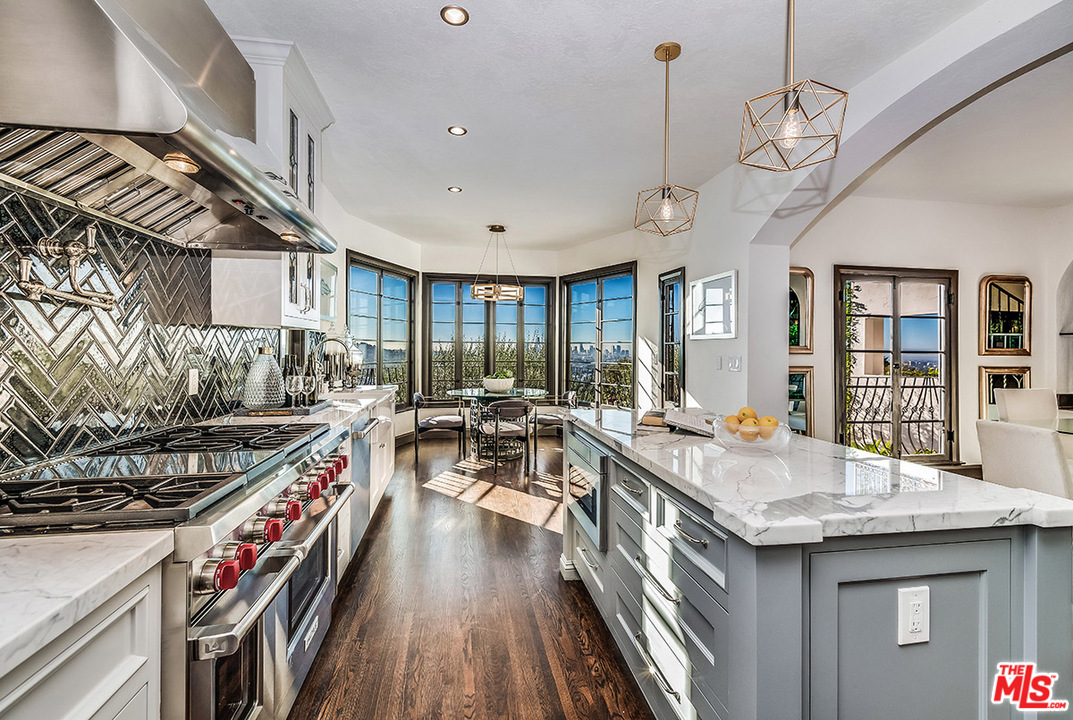 2426 Chislehurst Drive Los Angeles, CA 90027 - Photo 8 of 43 a open kitchen with stainless steel appliances granite countertop a stove and cabinets