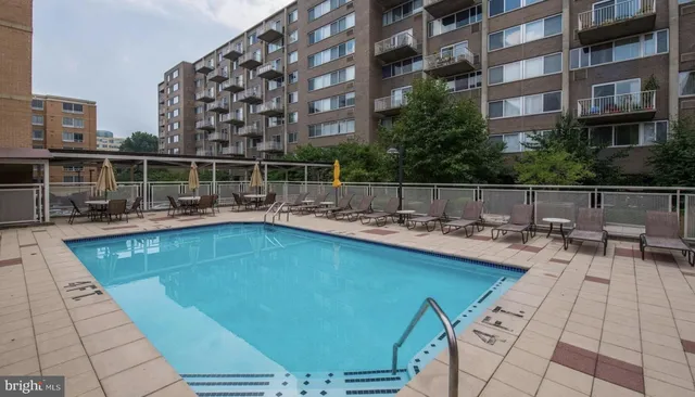 a view of a swimming pool with a lounge chairs