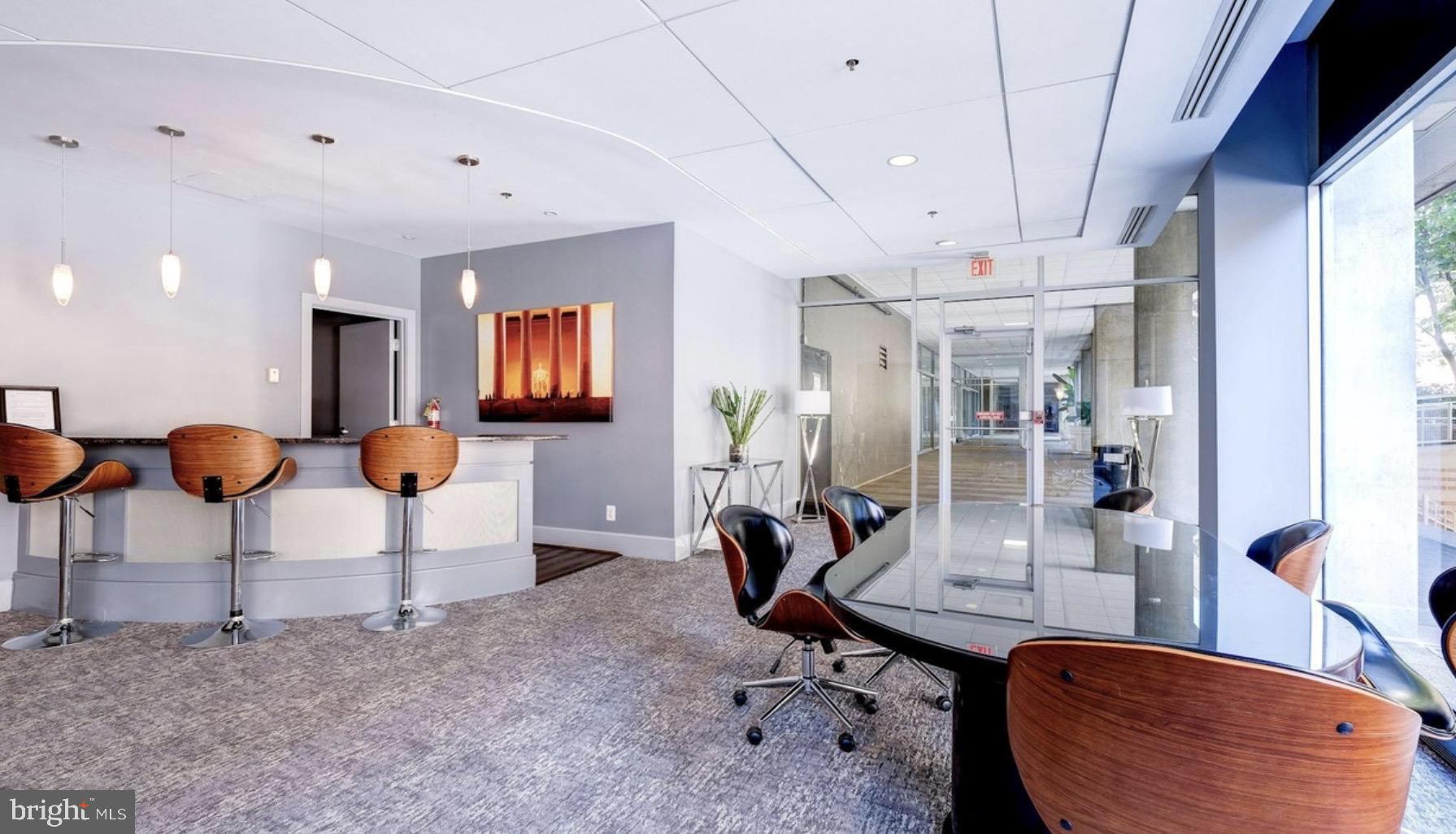 800 4th Street Southwest, Unit N120 Washington, DC 20024 - Photo 24 of 30 a room with lots of chairs and mirrors