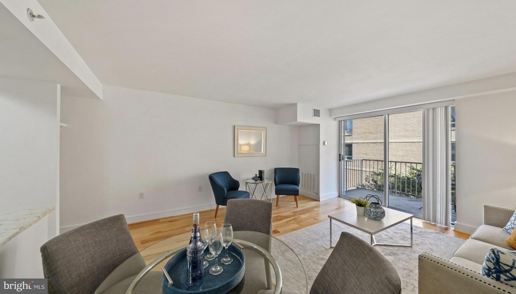 800 4th Street Southwest, Unit N120 Washington, DC 20024 - Photo 8 of 30 a living room with furniture and window