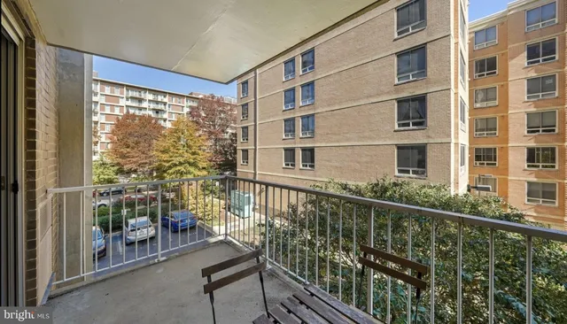 a view of a balcony with chairs