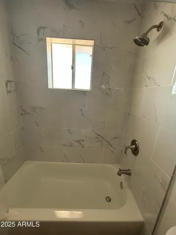 a close up of a bathtub in a bathroom