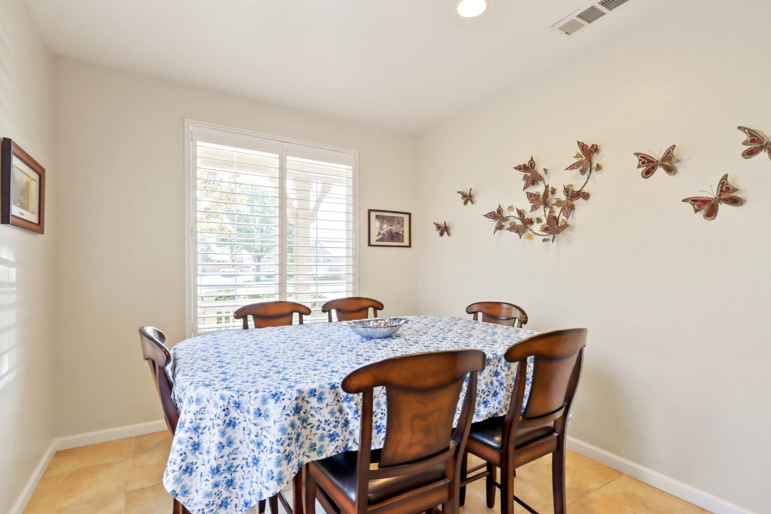 7401 Rothschild Court Elk Grove, CA 95757 - Photo 14 of 42 a view of a dining room with furniture and window