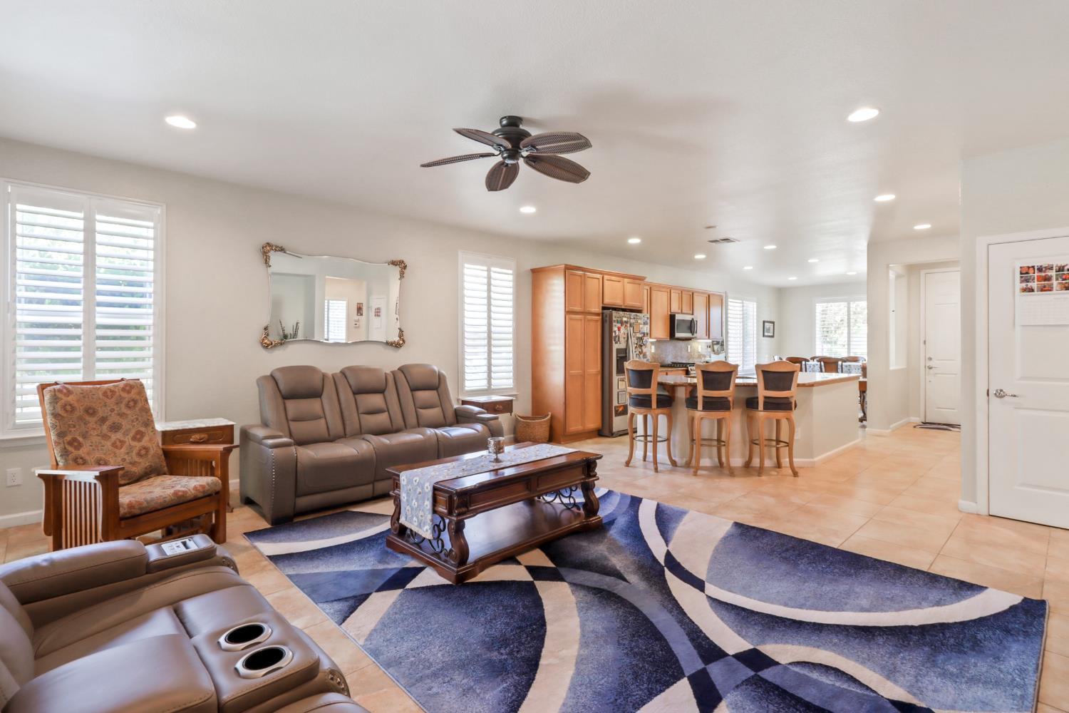 7401 Rothschild Court Elk Grove, CA 95757 - Photo 18 of 42 a living room with furniture kitchen view and a wooden floor