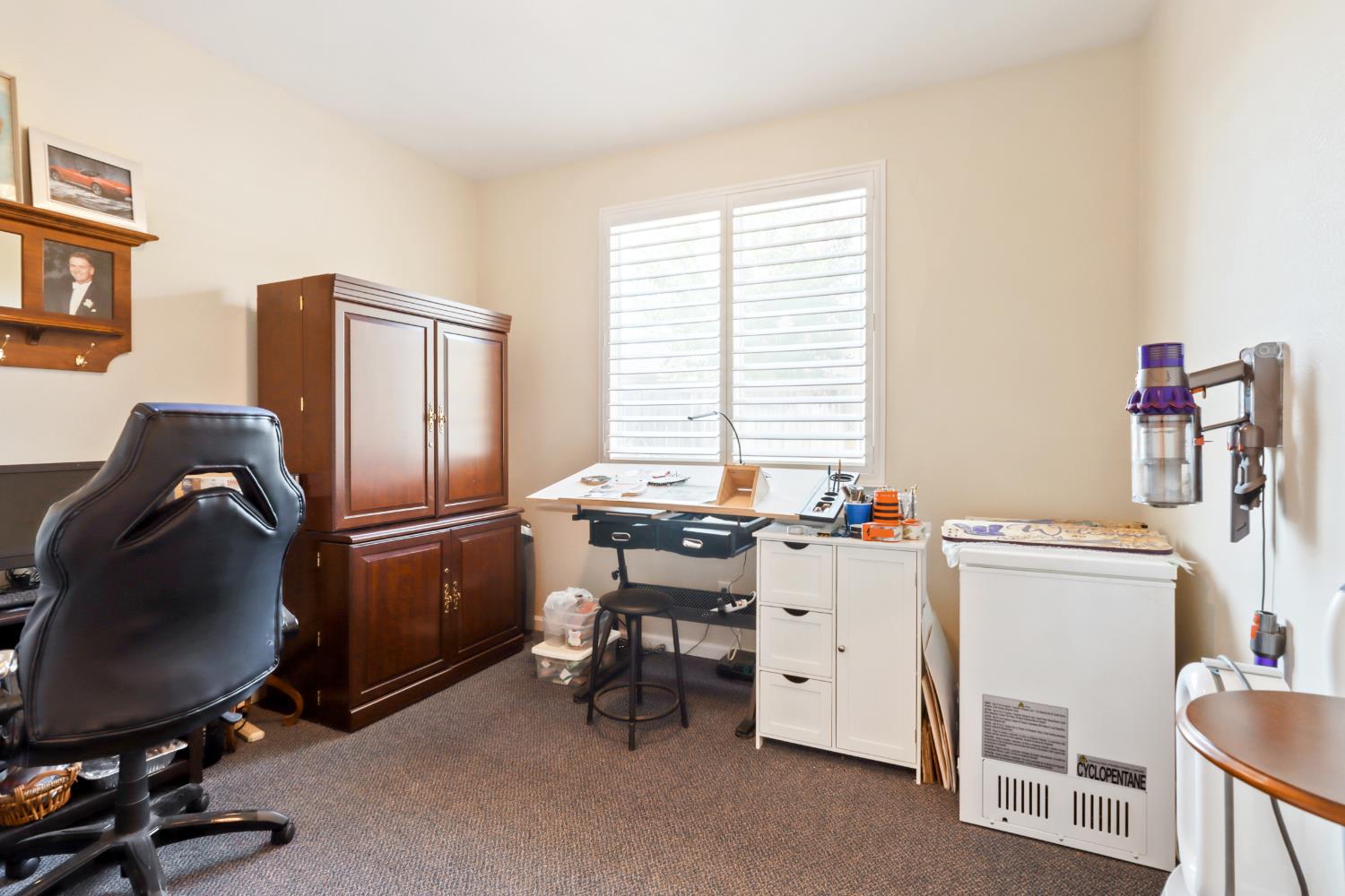 7401 Rothschild Court Elk Grove, CA 95757 - Photo 28 of 42 a room with a chair and appliances