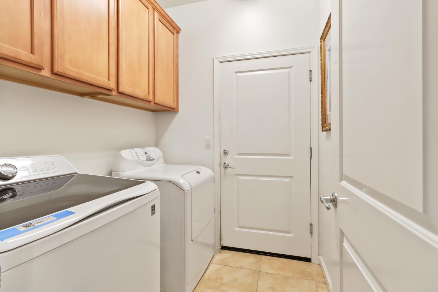 7401 Rothschild Court Elk Grove, CA 95757 - Photo 29 of 42 a utility room with dryer and washer