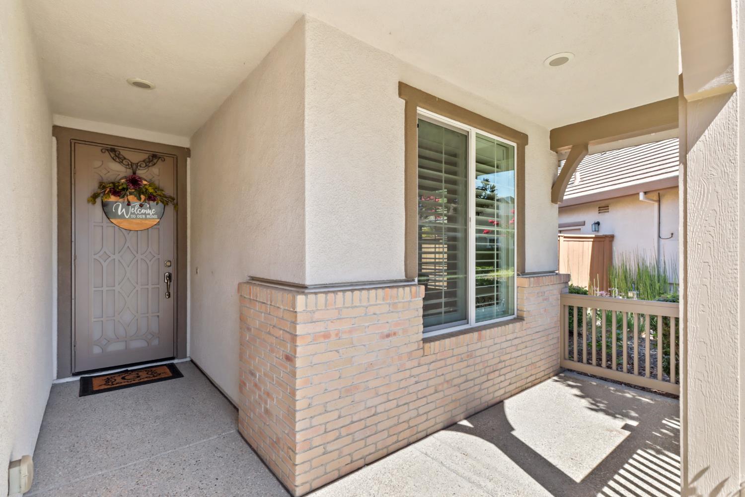 7401 Rothschild Court Elk Grove, CA 95757 - Photo 3 of 42 a view of a hallway with wooden floor and a fireplace