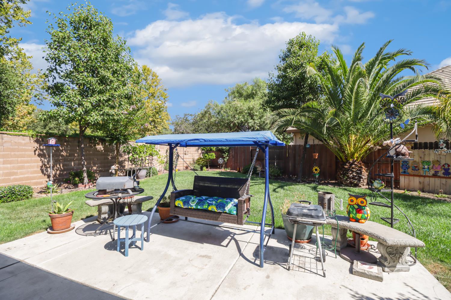 7401 Rothschild Court Elk Grove, CA 95757 - Photo 31 of 42 a view of backyard with outdoor seating and trees