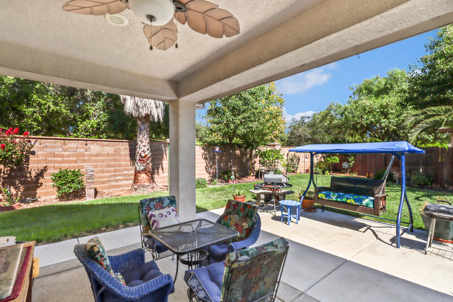 7401 Rothschild Court Elk Grove, CA 95757 - Photo 32 of 42 a outdoor space with patio the couches and a dining table with garden view