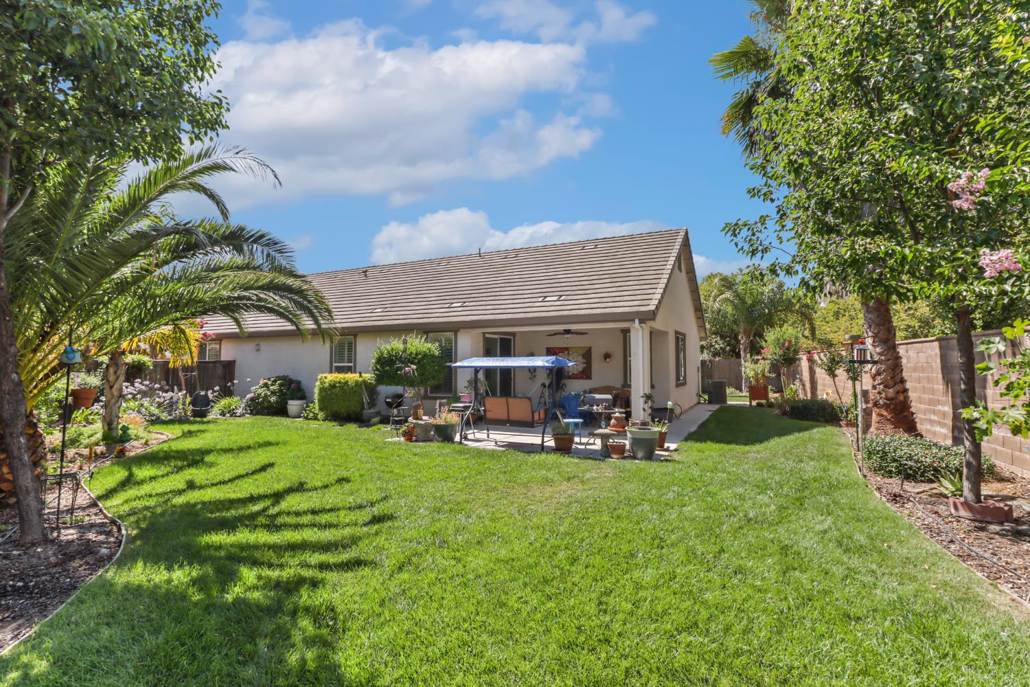 7401 Rothschild Court Elk Grove, CA 95757 - Photo 37 of 42 a view of a house with backyard porch and sitting area