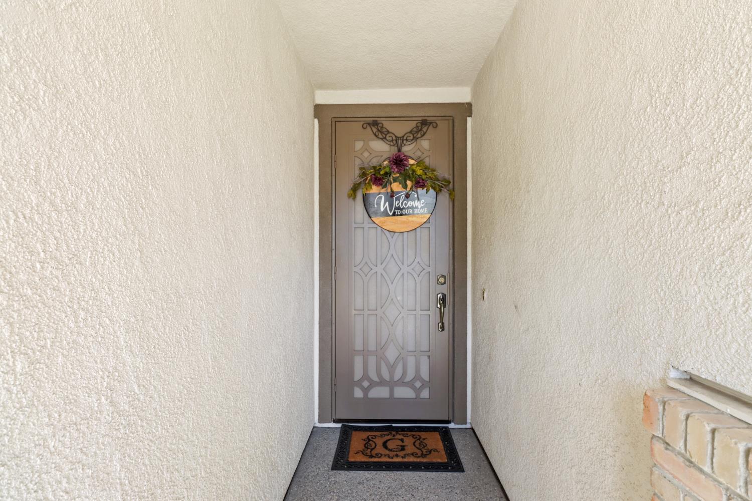 7401 Rothschild Court Elk Grove, CA 95757 - Photo 4 of 42 a view of front door with wooden floor