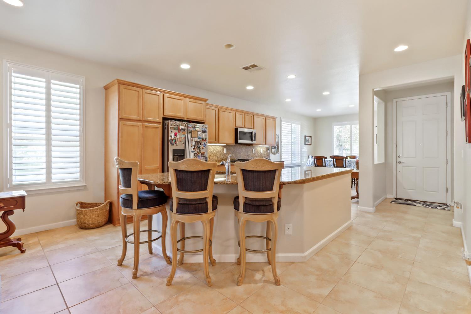 7401 Rothschild Court Elk Grove, CA 95757 - Photo 6 of 42 a open kitchen with cabinets table and chairs
