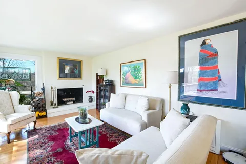 a living room with furniture couches and a fireplace