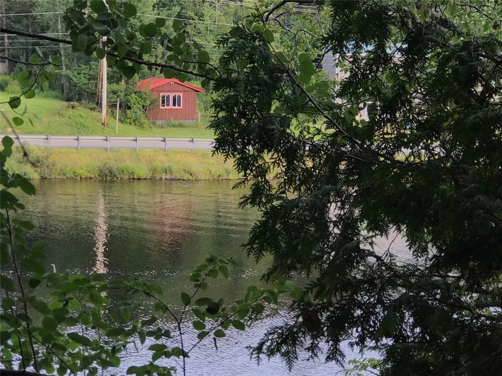 62 Jackman Road Rockwood, ME 04478 - Photo 4 of 19 View of camp from across the river