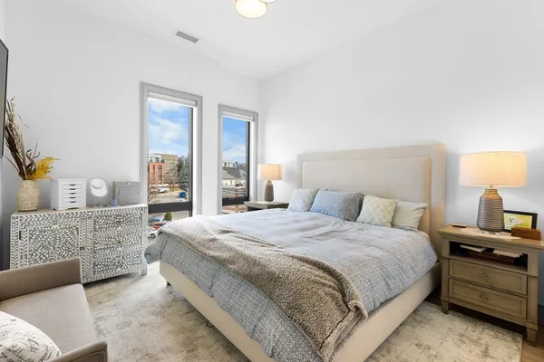 a bedroom with a bed and a couch