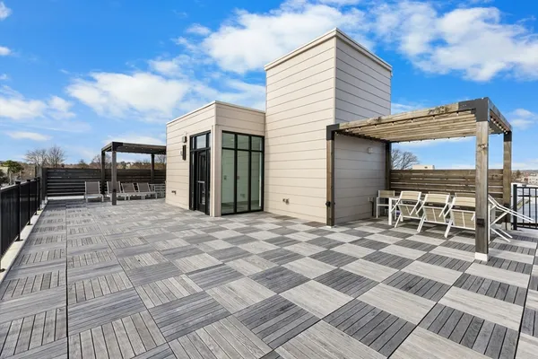 a view of backyard with sitting area